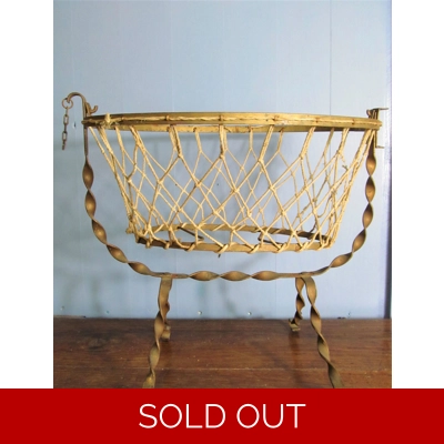 Antique French wrought iron and cotton mesh doll cradle.C1920